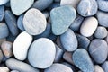 Abstract background with round pebble stones. Stones beach smooth. Top view. Summer day. Close-up Royalty Free Stock Photo