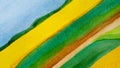 Abstract background rural landscape diagonal watercolor drawn stripes of tape in blue, yellow, green and brown Royalty Free Stock Photo