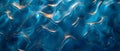 Abstract background of shimmering blue and gold fluid waves, luxurious and dynamic texture with sparkling details. Royalty Free Stock Photo