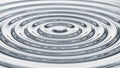 Concentric Silver Water Ripples Abstract Background with Metallic Sheen and Circular Waves Royalty Free Stock Photo