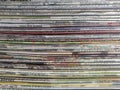 Abstract background of sideview of stack of used newspapers. Royalty Free Stock Photo