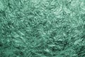 Abstract background of small green threads under cellophane. Close-up Royalty Free Stock Photo