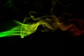 Abstract background smoke curves and wave reggae colors green, yellow, red colored in flag of reggae music Royalty Free Stock Photo