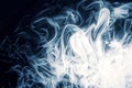 Abstract background of smoke billowing in the dark