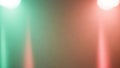 Abstract background with soft glowing lights in green and red hues and dust particles Royalty Free Stock Photo
