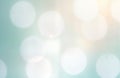 Abstract background with soft light bokeh. Gentle light effect with pale blue tones. Water droplets create circular bright spots.