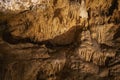 Abstract background of stalactites, stalagmites and stalagnates in a cave, horizontal