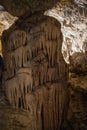 Abstract background of stalactites, stalagmites and stalagnates in a cave, vertical