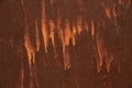 Streaks of orange paint on the old rusty metal surface. Background, structure. Royalty Free Stock Photo