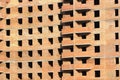 Abstract background of sunlit brick multistory building under construction Royalty Free Stock Photo