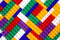 Abstract background texture of colored constructor blocks. Background of colorful plastic part of constructor. Pile of colored toy