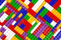 Abstract background texture of colored constructor blocks. Background of colorful plastic part of constructor. Pile of colored toy