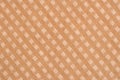 fabric closeup with a checkered pattern brown color. Royalty Free Stock Photo