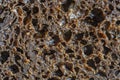 Abstract background or texture homemade black bread, close up