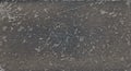 Abstract background texture of old worn genuine black leather. Space for text. Closeup.