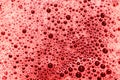 Abstract background and texture of red bubbles with light illumination Royalty Free Stock Photo