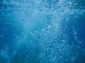 Abstract background of underwater bubbles in Kolona double bay Kythnos island Cyclades Greece, Aegean sea. Royalty Free Stock Photo