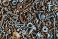 Abstract background with various screws, nuts, bolts and washers and other fasteners. Macro Royalty Free Stock Photo