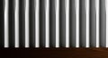 Abstract Background of Vertical White Ribbed Panels and Dark Wood Surface texture pattern Royalty Free Stock Photo