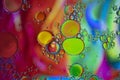 Abstract background with vibrant colours. Oil drops in water. Close colorful and artistic bubbles. Space pattern Royalty Free Stock Photo