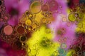 Abstract background with vibrant colours. Oil drops in water. Close colorful and artistic bubbles. Space pattern Royalty Free Stock Photo