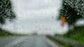 Abstract background - View of the road through the rain drops-covered window