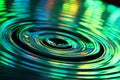 Abstract background of water drops splashes and colorful ripples on water surface Royalty Free Stock Photo