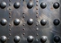 Abstract background of weathered steel plate and rivets Royalty Free Stock Photo