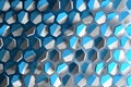 Abstract background with white and blue hexagonal shapes flying in space.