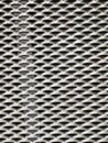 Abstract background of a white industrial expanded metal mesh pattern Royalty Free Stock Photo