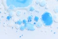 Abstract background with white and mixed blue paint drops Royalty Free Stock Photo