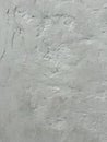 Abstract background with white plaster. Grey color. Vertical composition. Uneven wall with plaster. Vintage or rough Royalty Free Stock Photo