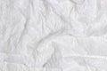 Abstract background of white plastic wrap material. Crumpled wrinkled plastic cellophane. Reflecting light and shadow on Royalty Free Stock Photo