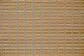 Abstract background wooden blinds against of bright sunlight closeup