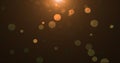 background of yellow orange gold glowing particles and bokeh dots of festive energy magic Royalty Free Stock Photo