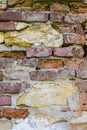 Abstract backgrounds: ancient ruined red brick wall with lime stones