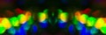 Abstract banner. Background consisting of multi-colored circles. Defocus, black background