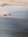 Abstract beach painting with brush strokes, coastal. Hand drawn art. Muted beige and blue texture oil on canvas Royalty Free Stock Photo