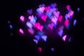 Abstract beautiful blurred violet-purple-lilac and pink colored of swirling heart shaped bokeh from ornamental lights flickering