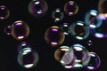 Abstract Beautiful Colorful Transparent Soap Bubbles on Black Background. Soap Suds Bubbles Water Royalty Free Stock Photo