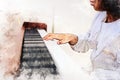 Kid girl hand playing keyboard of the piano foreground Watercolor painting background and Digital illustration brush to art. Royalty Free Stock Photo