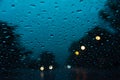 Abstract Beautiful street light bokeh Background . Blurred background with  Rain drops on the windshield Royalty Free Stock Photo