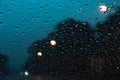 Abstract Beautiful street light bokeh Background . Blurred background with  Rain drops on the windshield Royalty Free Stock Photo