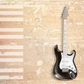 Abstract beige grunge piano background with electric guitar Royalty Free Stock Photo