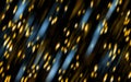 Abstract golden and blue bokeh circles on black background. Royalty Free Stock Photo