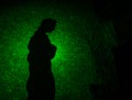 abstract black background with green color lasers and a woman figure silhouette. Royalty Free Stock Photo