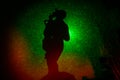 abstract black background with green color lasers and a woman figure silhouette. Royalty Free Stock Photo