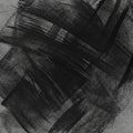 Abstract black brush strokes on a textured gray surface create a dynamic Royalty Free Stock Photo