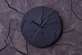 abstract black clock on cracked slate background Royalty Free Stock Photo