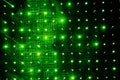 Abstract black digital technology background with green luminous particles dots. Matrix of virtual reality